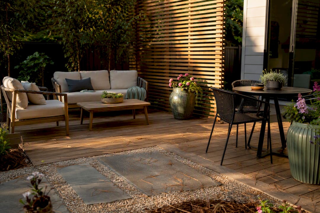 L-shaped patio with dining and lounging zones