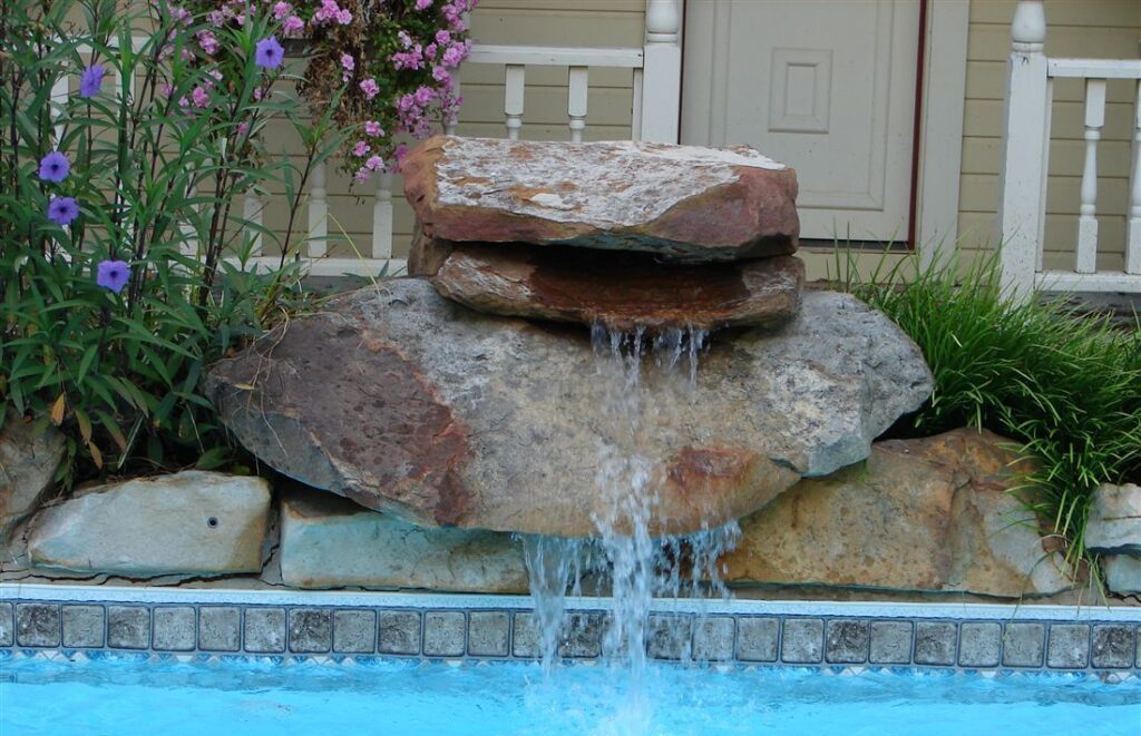 Boulder waterfall, spilling into a pool