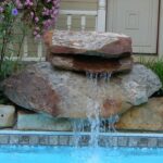 Boulder waterfall, spilling into a pool