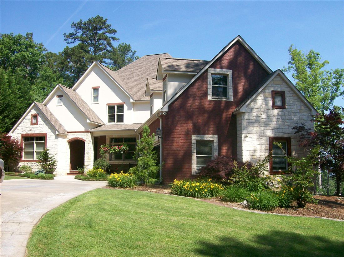 Brick and limestone, with arched entry