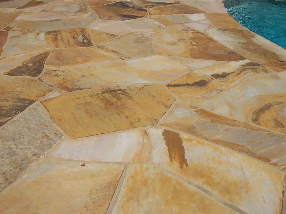 Brown flagstone, at the pool edge