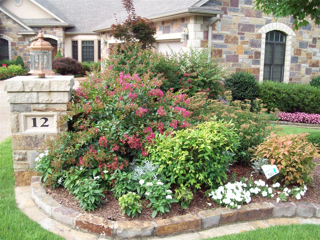 Column 12, copper lantern and a planted island