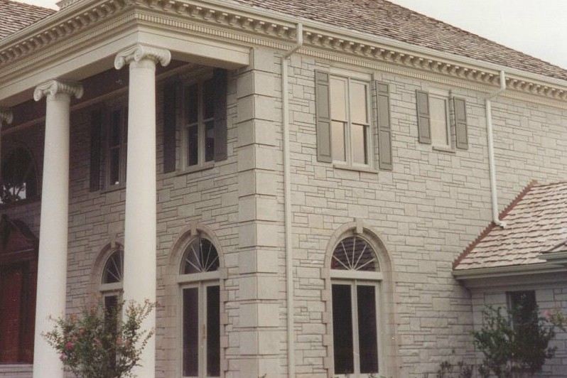 Cut limestone colonial, with columns