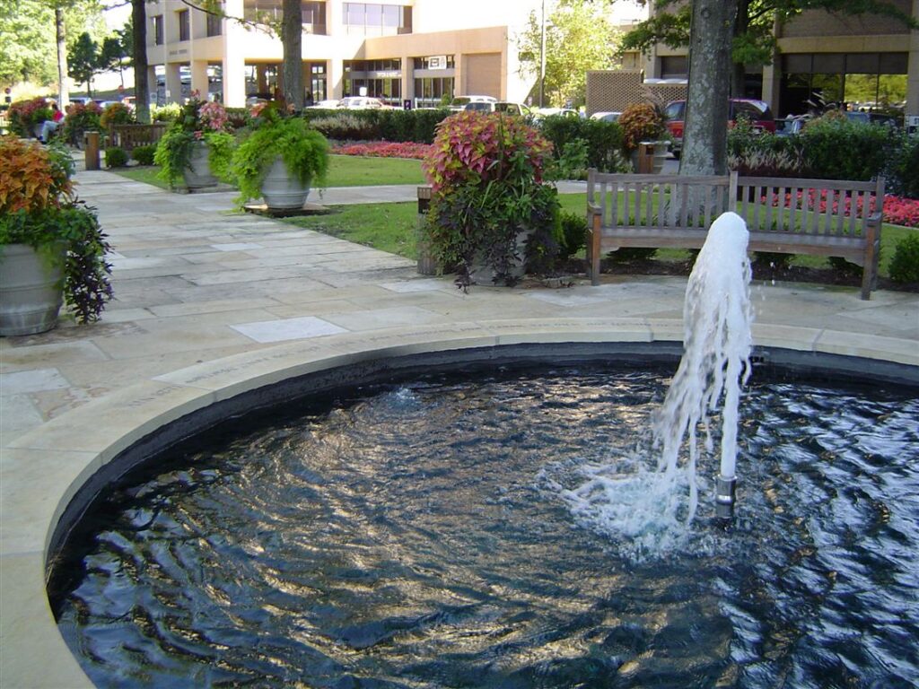 Cut-limestone plaza, with fountain
