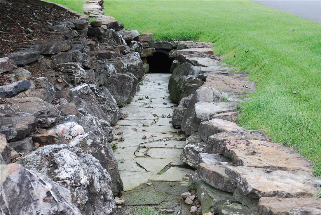 Dry creek bed, boulders and creek rock carry the runoff
