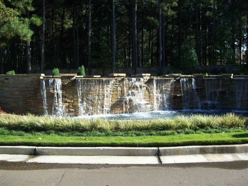 Entry waterfall wall, cut stone, planted