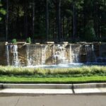 Entry waterfall wall, cut stone, planted