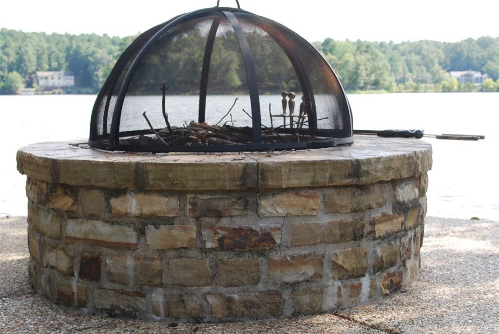 Fire pit on the water, chopped stone, screen dome