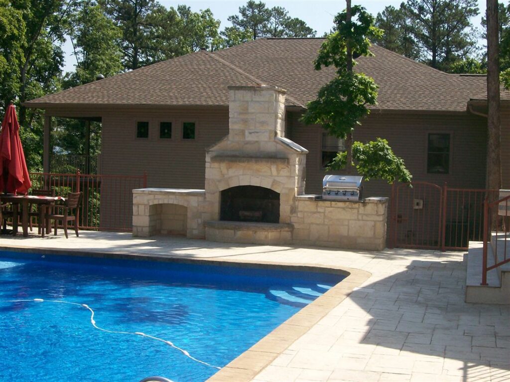 Fireplace and grill, cut limestone, beside the pool