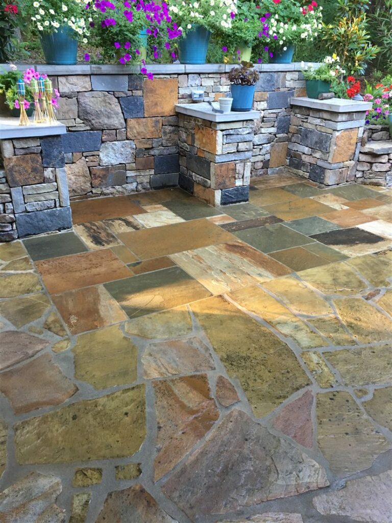 Flagstone patio, stone planters and outdoor kitchen