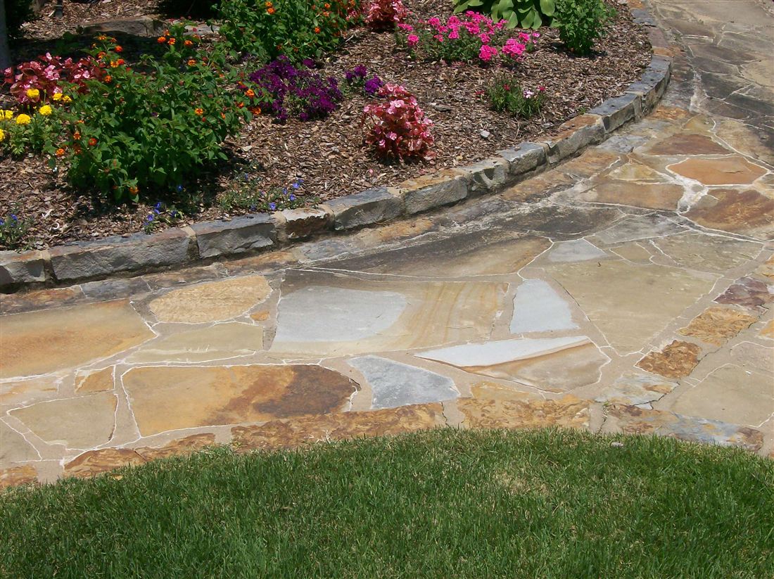 Flagstone patio, with a stone-edged bed