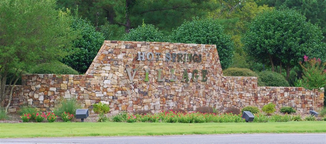 From the entrance drive, the sign at the tree line