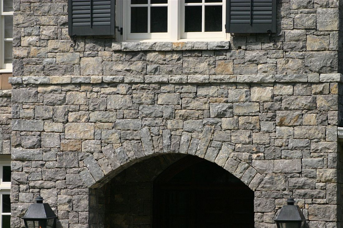 Gray limestone, arched entry