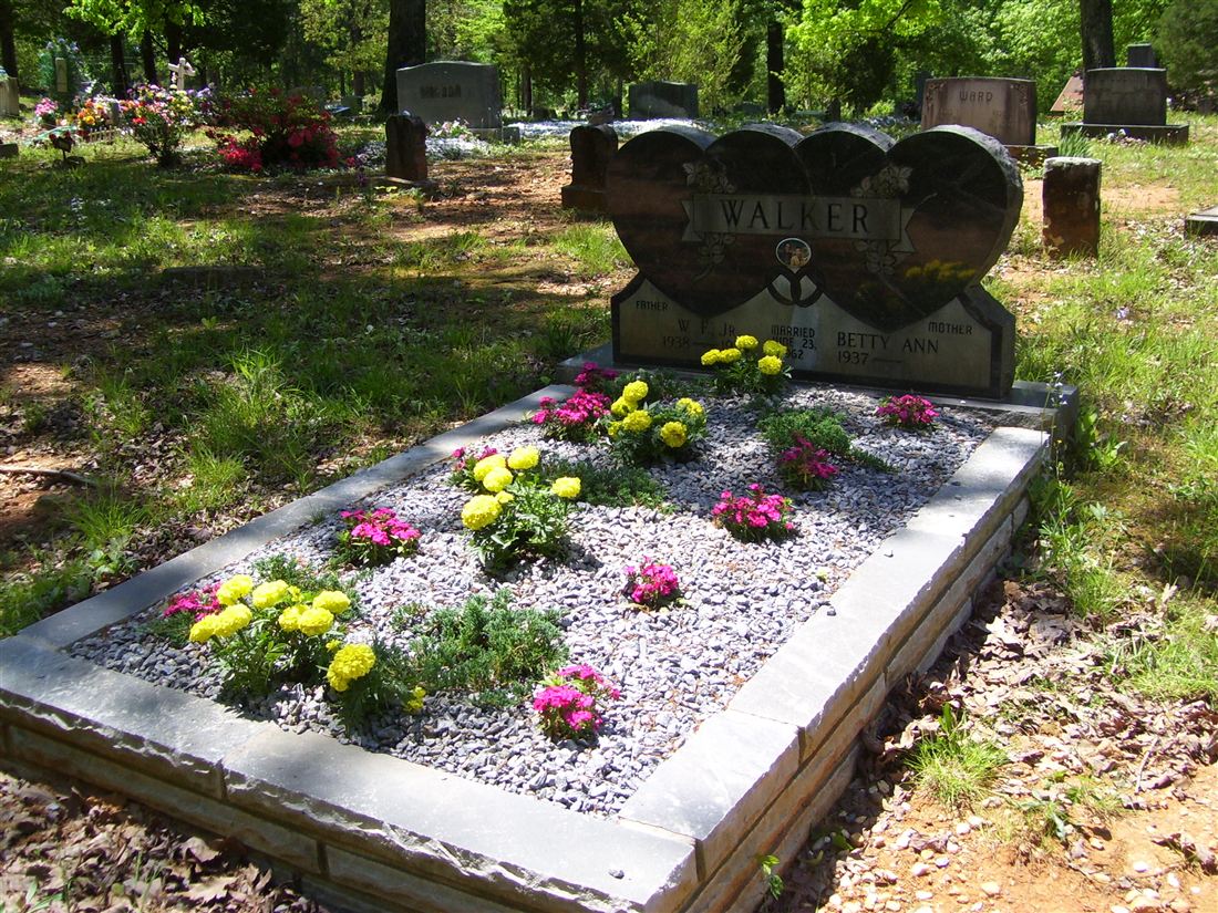 Heart headstone, with a stone-edged gravel bed
