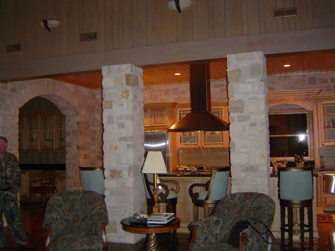 Kitchen, stone columns and arches