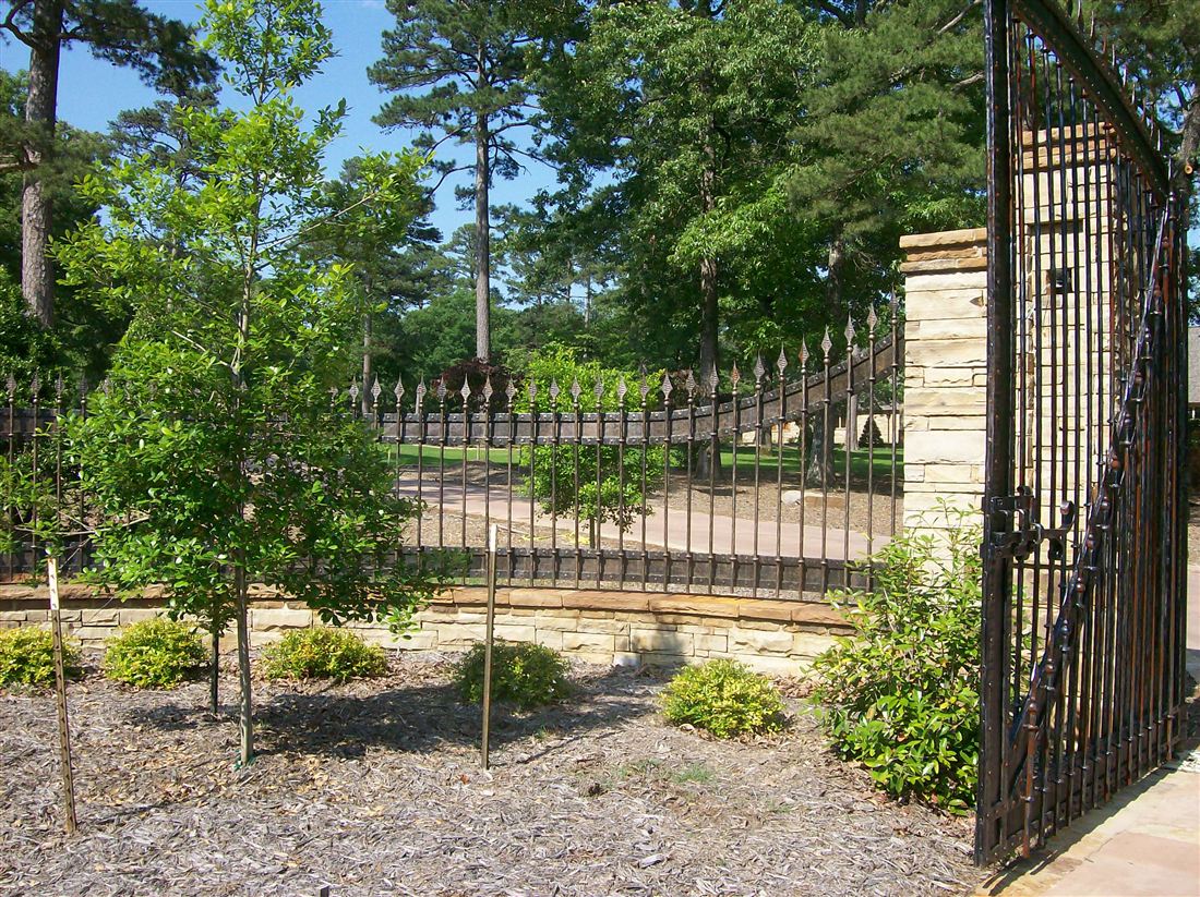 Ledge-stone house, iron gate