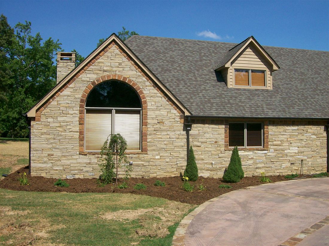 Ledge-stone ranch, arched window