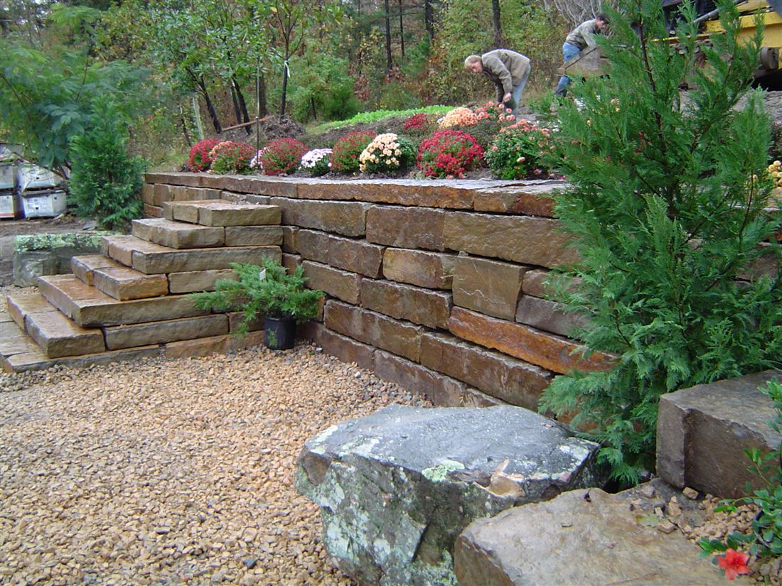 Ledge-stone terraces, with mums and slab steps
