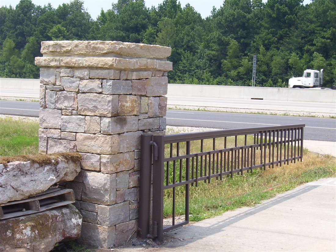 Limestone gate columns, iron gate