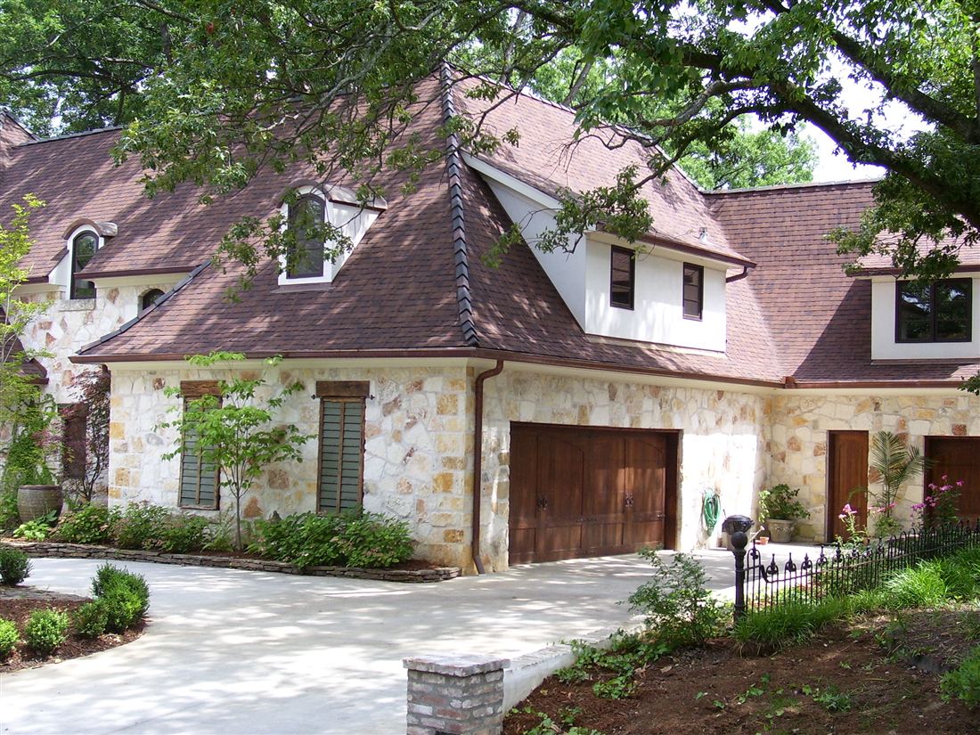 Limestone house, stone wall and iron fence