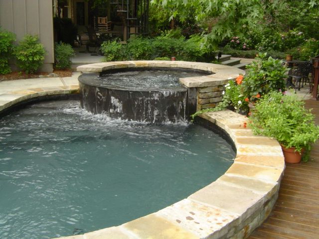 Raised spa, spillover into the pool