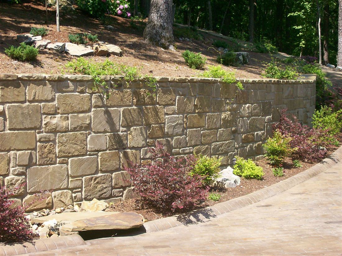 Retaining wall, along the drive