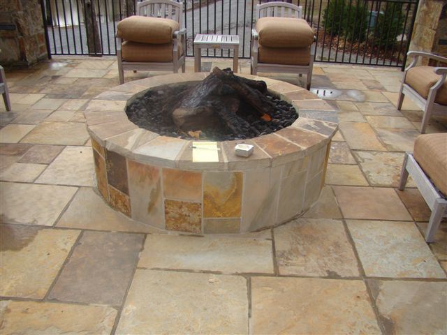 Round fire pit, on a flagstone patio