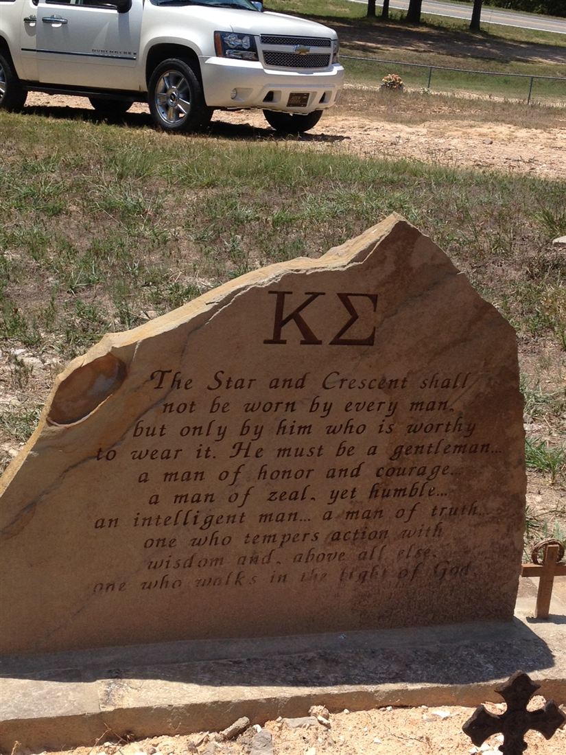 Sandstone headstone, with engraved scene