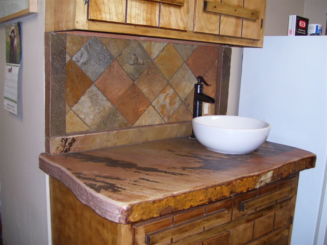 Slate backsplash, stone slab counter