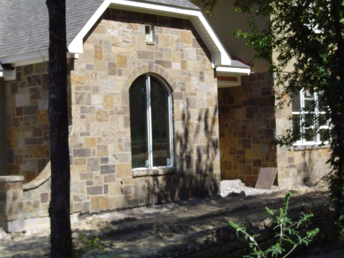 Stone house, arched window