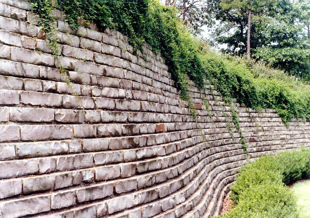Terraced ashlar walls, with plantings on every tier