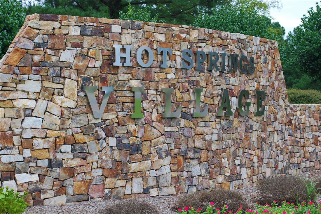 The letters, metal on mosaic stone, close