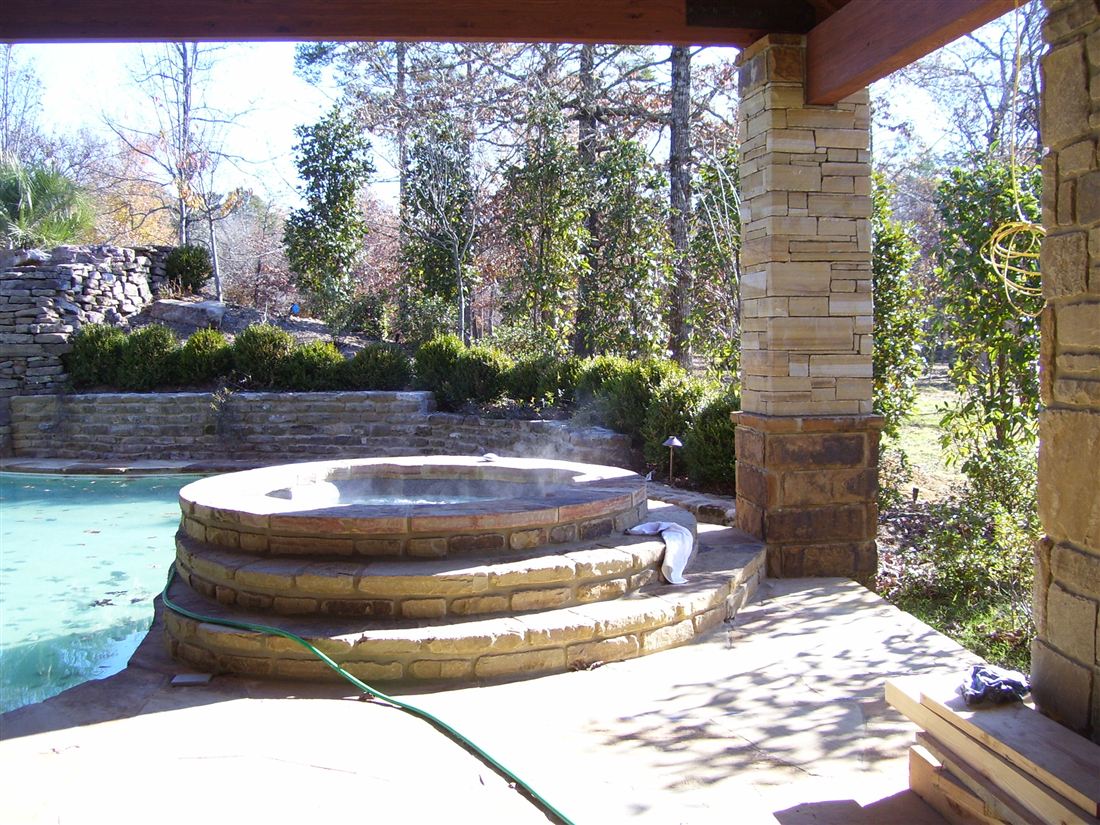 The spa, stone steps up to the rim