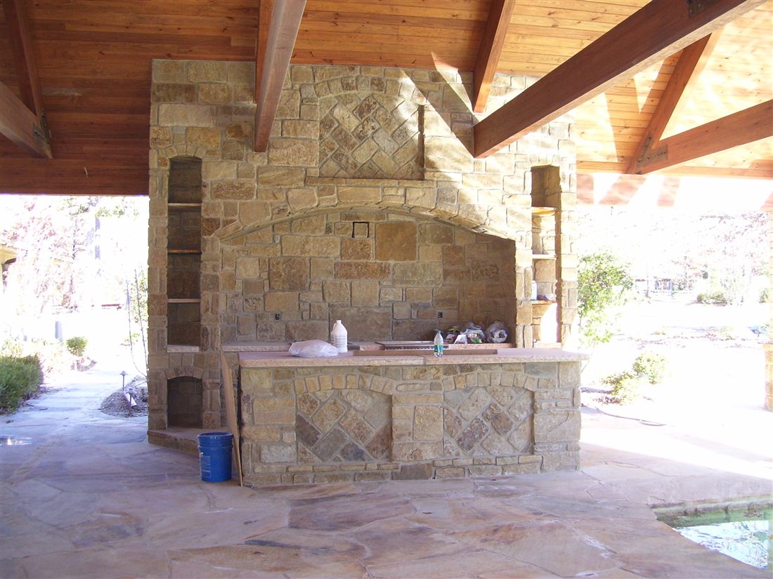 Under the roof, fireplace and kitchen island