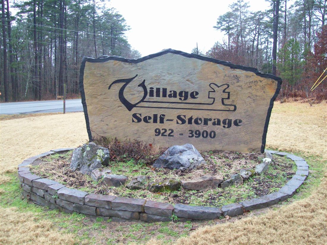 Village Self-Storage, engraved boulder